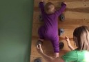 A baby learning how to climb