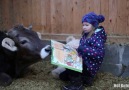 A child tells a bedtime story to her friend