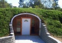 A Green-Roofed Hobbit Prefab Home