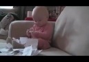 Baby has fun with paper