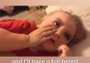 Baby reacts to daddy shaving his beard.
