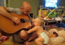 Baby rocks out with dad playing Bon Jovi