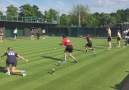 Ball boys and girls train on grass