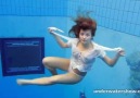 Beautiful Girl swimming nude in the pool