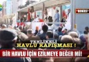 Bir havlu için birbirini ezen vatandaşlar.