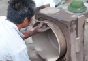 ( ) Casting and molding an aluminum pot in traditional way.Credit AnhQuocFILM -