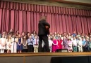 Children 2nd grade singing Wasted Years )Video by Chris Fitzgerald.