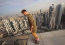 Daredevil Rides Hoverboard on Edge of Rooftop