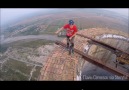 Daredevil Unicycles Around Giant Chimney