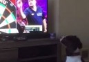 Dog Chases Darts On TV