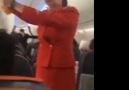 Football fans distract flight attendant doing her safety announcement