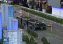 Futuristic straddling bus allows cars running underneath