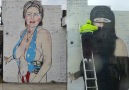 Graffiti artist turns Hillary Clinton into a Muslim