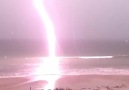 Incredible lightning strike left a trail of burnt air hanging in the sky.