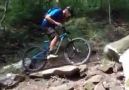 Jeff Lenosky hopping up a steep rock hill