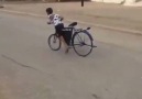 Kid drifting a bicycle