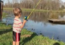 Little Boy Catches Fish with Toy Rod