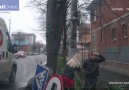 Man is flattened by a road sign after a car crashes into it