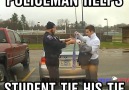 Policeman Helps Student Tie His Tie