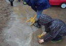 School Age Gathering Water to Fill the Bucket