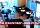 Silahlı soyguncuyu sandalyeyle etkisiz hale getirdi!