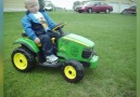 Sleepy Tot Takes Nap On Toy Tractor