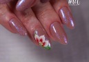 Sparkles and a floral design on the nails is simply outstanding