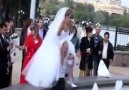 The Bride and the groom wants to take a picture in the pool..