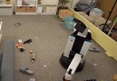 The video shows robot tidying up a messy room