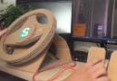 This cardboard steering wheel for PS4 is made using an old PC mouse via