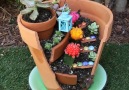 This fairy garden is a magical addition to any outdoor space!