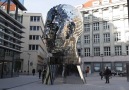 This giant, moving Franz Kafka head stares at City Hall in Prague
