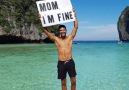 This guy travelled the world carrying this Mom Im fine sign