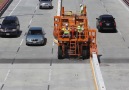 This machine creates a barrier between construction sites and cars.