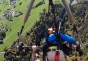 This man is NOT attached to his hang-glider!
