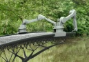 This 9920 pound steel bridge was 3-D printed in midair.