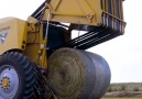 This speedy tractor collects and bales hay.