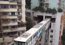 This train runs through a residential building