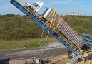 This truck dump lifts 90 ton trucks to a 63 degree angle.