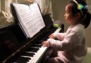 Three Years Old Girl Playing Piano.