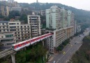 Train goes through the center of a 19-Storey block in China...