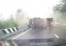 Truck slides on sharp curve hitting motorcyclist Credit ViralHog