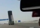 Truck smashes the road sign