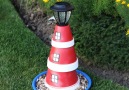 Turn a stack of terra cotta pots into a lighthouse for your garden!