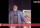 Uzun hava söyler gibi elma satan pazarcı