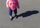 Watch a cute baby girl terribly scared of her own shadow