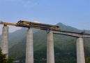 Watch how this mega machine constructs a bridge in mountains.