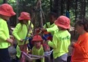 Weaving their story teepee with pieces of fleece.