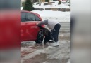 Woman Slipping On Ice Getting Into Car