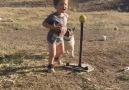 2-year-old swings the bat